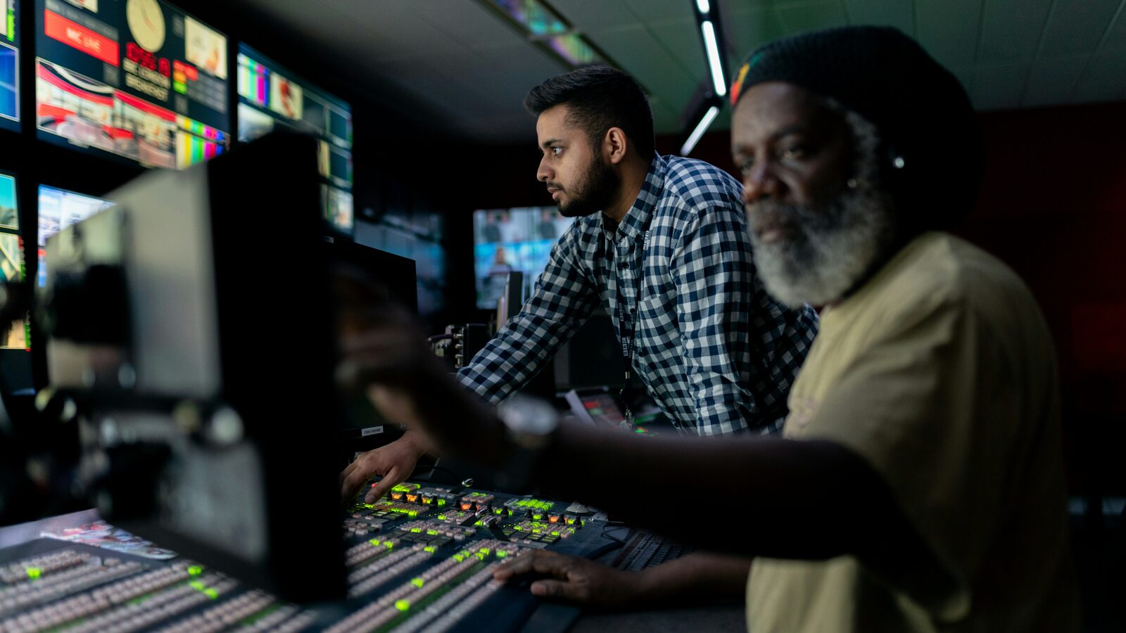 Two engineers monitoring systems in an operations centre